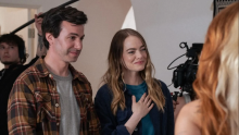 Nathan Fielder stands next to Emma Stone, with cameras and booms surrounding them. Photo: Richard Foreman Jr. / A24 / Paramount+ with SHOWTIME