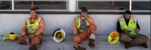 Los Angeles City street services workers take a break in the shade of a nearby storefront on July 27, 2023 in Woodland Hills, California. (Photo: Brian van der Brug/Los Angeles Times via Getty Images)