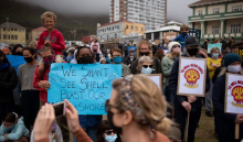People take part in a protest against the plan by Dutch oil company Shell to conduct underwater seismic surveys along South Africa in 2021. Photograph: Rodger Bosch/AFP/Getty Images