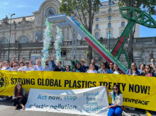 Greenpeace activists call for action ahead of the second session of global negotiations on plastic pollution, hosted in Paris in May 2023. (Michaela Cabrera/Reuters)