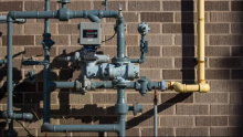 A gas meter and pipes are attached to a building in Halifax. Gas networks have been growing and adding customers in every province and territory that has one, a new report finds. (Robert Short/CBC)