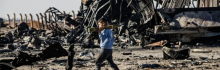 A boy carries an unexploded Rocket Propelled Grenade (RPG) at the site of the previous evening's Israeli airstrike that targeted shipments of weapons that belonged to Syrian government forces in Qamishli, in mainly Kurdish northeastern Syria, on December 10, 2024. The UN special envoy for Syria called on Israel on December 10 to halt its military movements and bombardments in Syria, after a war monitor reported 300 air strikes since the fall of president Bashar al-Assad. (Photo by DELIL SOULEIMAN/ (Photo by