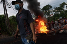 A highway blockade organized by Indigenous Kitchwa land defenders and allies, including CONAIE, protesting unwanted development and human rights violations by the Ecuadorian government. Photo: Ian Willms