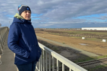 Éva Kozma looks out over the industrial park that houses Debrecen’s cluster of battery factories. Photo by: Nicholas Kusnetz / Inside Climate News