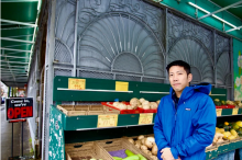 Michael Tan has fond memories of shopping at Sunrise Market with his great-aunt. But the future of the low-cost grocery store is up in the air following its listing for sale. Photo for The Tyee by Katie Hyslop.