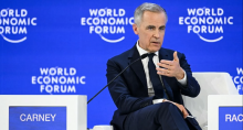Canadian Prime Minister Mark Carney speaks at the World Economic Forum in Davos, Switzerland, on 20 January 2026 (Fabrice Coffrini/AFP)