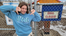 Prince George Iceman spokesperson Sylvia Masich makes her feelings known about unseasonably warm weather that has melted the ice on the city's outdoor ice oval on Wednesday. (Jason Peters/CBC)