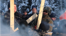 Members of the RCMP move in to enforce an injunction against Wet'suwet'en people and their supporters on a forest service road in the nation's traditional territory in northern B.C. on Jan. 7, 2019. (Chantelle Bellrichard/CBC)