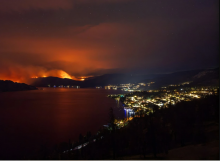 A view from Peachland shows flames and heavy smoke rising from the Bald Range wildfire near Summerland. Photo by DARREN HULL /AFP via Getty Images