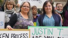 Katzie First Nation Chief Susan Miller (left) and her sister, Debbie Miller, stand with protesters outside the Kinder Morgan Trans Mountain hearings in Burnaby, B.C. on Wed. Jan. 20, 2016. Photo by Elizabeth McSheffrey.