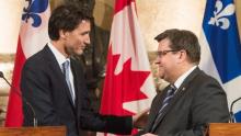Prime Minister Justin Trudeau shakes hands with Montreal Mayor Denis Coderre following their joint press conference about the proposed Energy East pipeline in Montreal on Tuesday, Jan. 26, 2016. (Graham Hughes/Canadian Press)