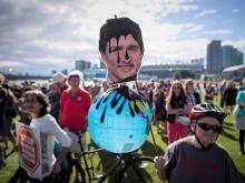 Vancouverites protesting in 2018 after Trudeau pledged $4.5 billion to buy Kinder Morgan’s Trans Mountain pipeline expansion. The public cost has leapt to $30.9 billion. Photo by Darryl Dyck via The Canadian Press.