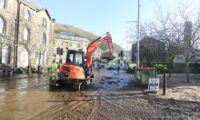 The clean up process begins in Hebden Bridge, West Yorkshire. Photograph: Barbara Cook/Demotix/Corbis