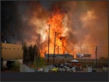 Wildfire burns city of Fort McMurray, Alberta on May 3, 4, 2016 (Tim Fortin, Flikr Commons)