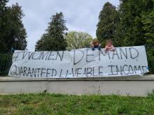 Members of the B.C. Women's Alliance (and their children) in New Westminster hung a banner in Victoria Hill as part of the group's campaign for a guaranteed livable income.contributed